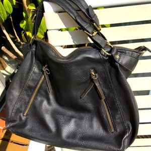 Steve Madden Lg  black bag. 2 handles. 2 Lg zip openings to roomy pkts in back.